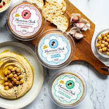 Load image into Gallery viewer, Whole chipotle peppers blended with creamy tahini, tender chickpeas, and our signature spice blend make this recipe rich and nourishing. Pair it with crunchy veggies, warm pita, and bowls.
