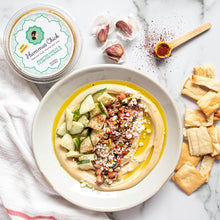 Load image into Gallery viewer, Hummus Chick&#39;s roasted garlic and cilantro hummus is the perfect addition to your fridge!
